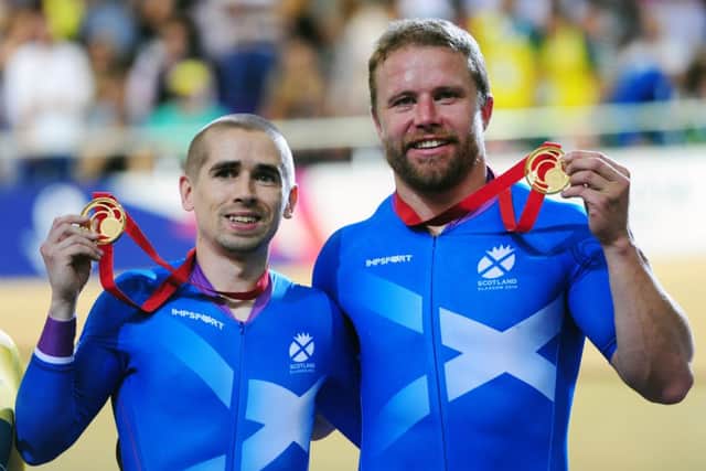 Neil Fachie and Craig MacLean show off their gold medals in the Sir Chris Hoy Velodrome. Picture: Ian Rutherford