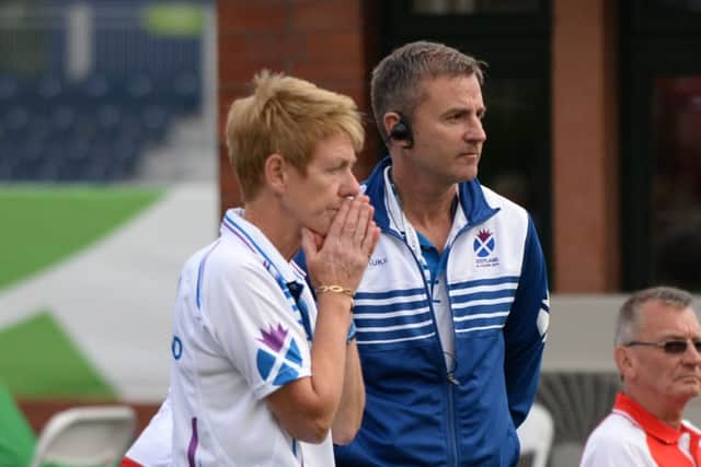 Team Scotland Bowls Manager David Gourley talks to Scotland skip Margaret Letham. Picture: PA