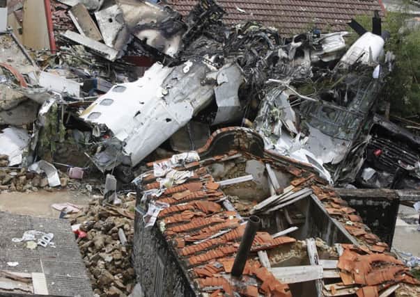 The aftermath of the wreckage of TransAsia Airways flight GE222 after it crashed. Picture: Getty