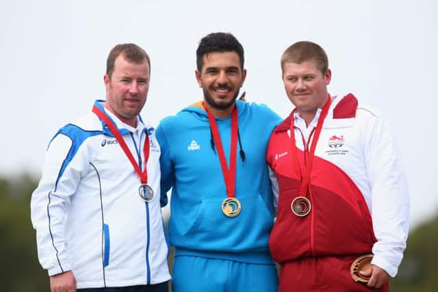 Drew Christie of Scotland, left, Georgios Achilleos, centre, and, Rory Warlow of England celebrate on the podium. Picture: Getty
