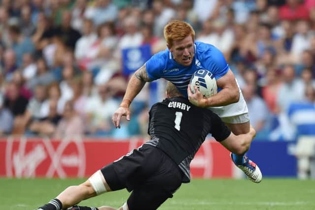 Scotland's Roddy Grant is tackled by New Zealand's Scott Curry. Picture: Ian Rutherford