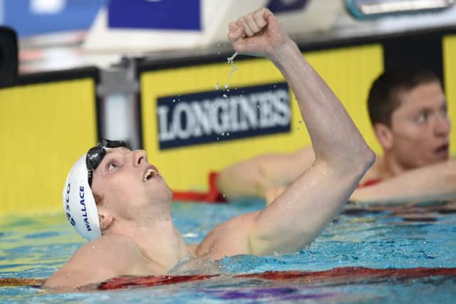 Scotland's Daniel Wallace celebrates winning gold in the Men's 400m Individual Medley. Picture: Jane Barlow