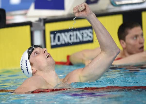 Scotland's Daniel Wallace celebrates winning gold in the Men's 400m Individual Medley. Picture: Jane Barlow