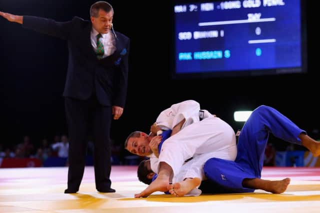Euan Burton of Scotland, in white, defeats Shah Hussain Shah of Pakistan in the Men's +100kg Judo gold medal final. Picture: Getty