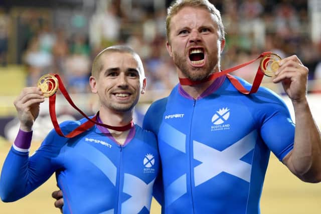 Scotland's Neil Fachie, left, and pilot Craig MacClean win gold in the Men's Para-Sport Sprint B Tandem final against Australia. Picture: Jane Barlow