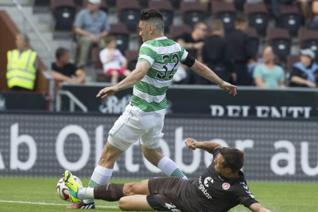 St Pauli's Soeren Gonther and Celtic's Tony Watt compete for the ball. Picture: AP