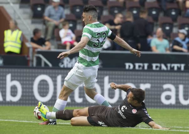 St Pauli's Soeren Gonther and Celtic's Tony Watt compete for the ball. Picture: AP