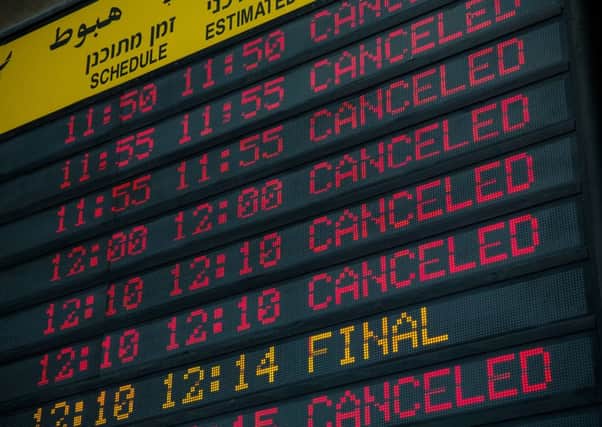 The arrivals gate board shows cancelled flights at terminal three at Ben Gurion Airport. Picture: Getty