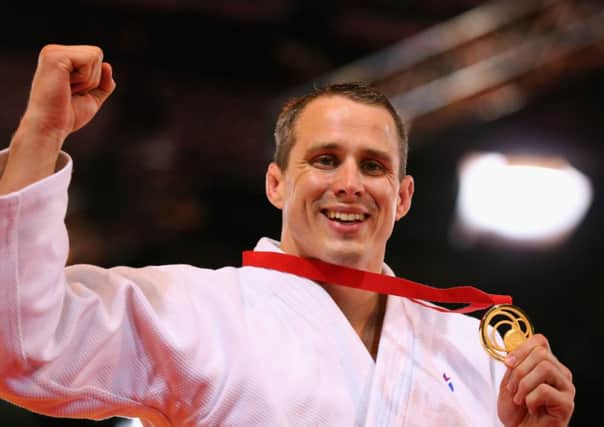 Gold medalist Euan Burton of Scotland on the podium during the medal ceremony for the Men's +100kg Judo final. Picture: Getty