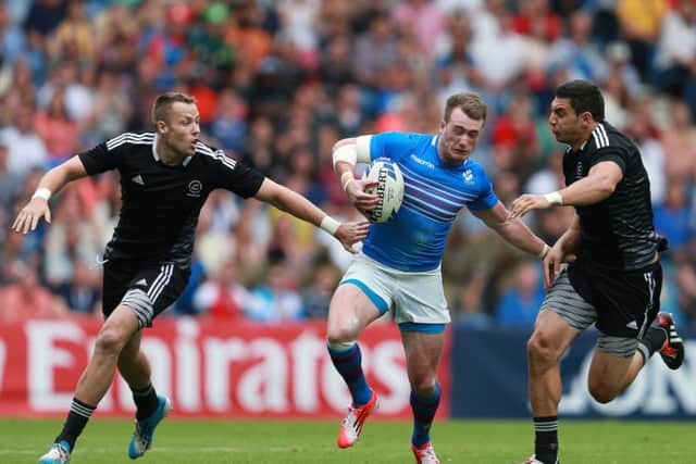 Scotland's Stuart Hogg is tackled by New Zealand's Bryce Heem during the Rugby 7's tournament at Ibrox Stadium. Picture: PA