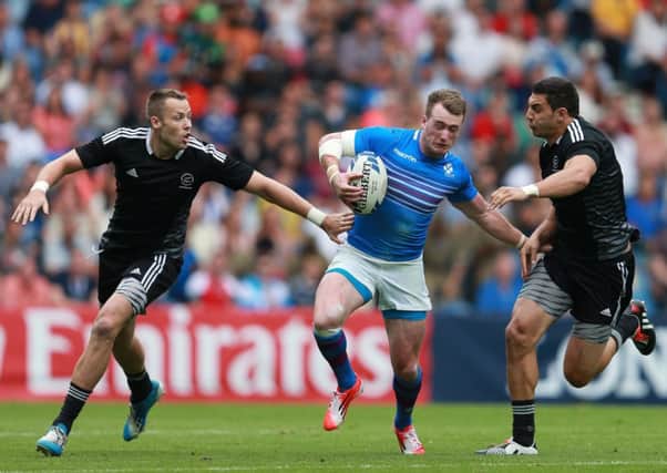 Scotland's Stuart Hogg is tackled by New Zealand's Bryce Heem during the Rugby 7's tournament at Ibrox Stadium. Picture: PA