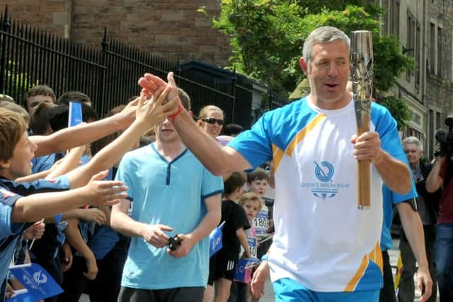 Ex Scotland Rugby International Gavin Hastings with the Queen's Baton Relay. Picture: TSPL