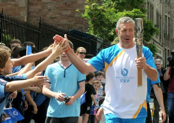 Ex Scotland Rugby International Gavin Hastings with the Queen's Baton Relay. Picture: TSPL