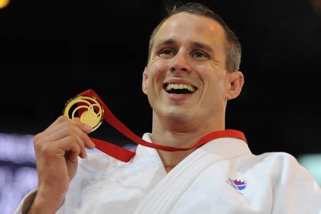 Euan Burton with his gold medal. Photo by Neil Hanna