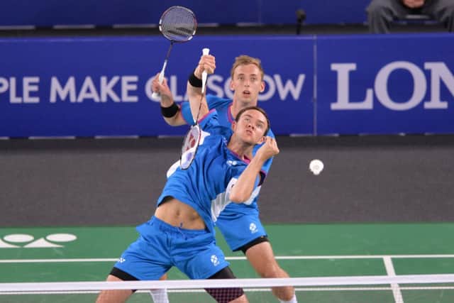 Patrick McHugh and Martin Campbell try and salvage their tie against Malaysia. Picture: Lorraine Hill