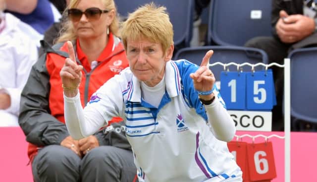 Scotland's Margaret Letham tells lead Claire Johnstone how short her last bowl was. Picture: Lorraine Hill