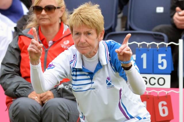 Scotland's Margaret Letham tells lead Claire Johnstone how short her last bowl was. Picture: Lorraine Hill