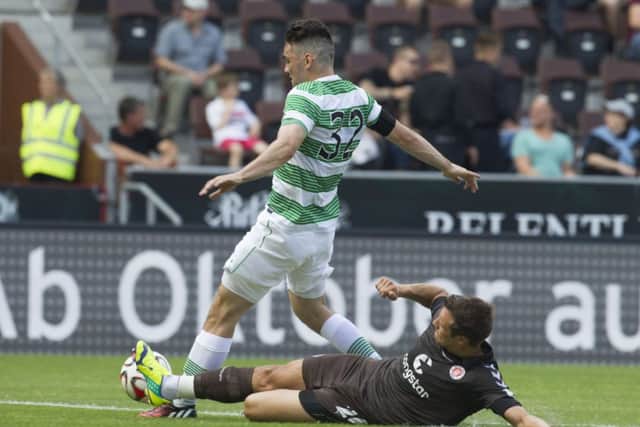 St Paulis Soren Gonther tackles Tony Watt, who was accused of disrupting Bahrudin Atajics penalty attempt. Picture: AP