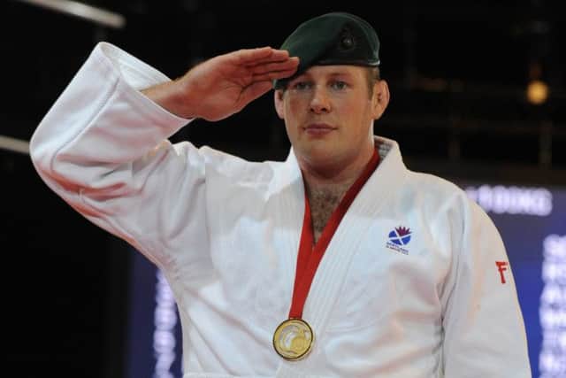 Chris Sherrington dons his green beret when he wins a judo tournament as a reminder to all of where his loyalty lies. Picture: Neil Hanna