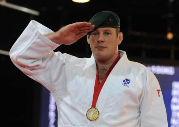 Chris Sherrington dons his green beret when he wins a judo tournament as a reminder to all of where his loyalty lies. Picture: Neil Hanna