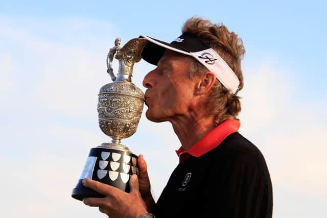 Bernhard Langer kisses the trophy after his victory by 13 strokes in the Senior Open at Royal Porthcawl yesterday. Picture: Getty