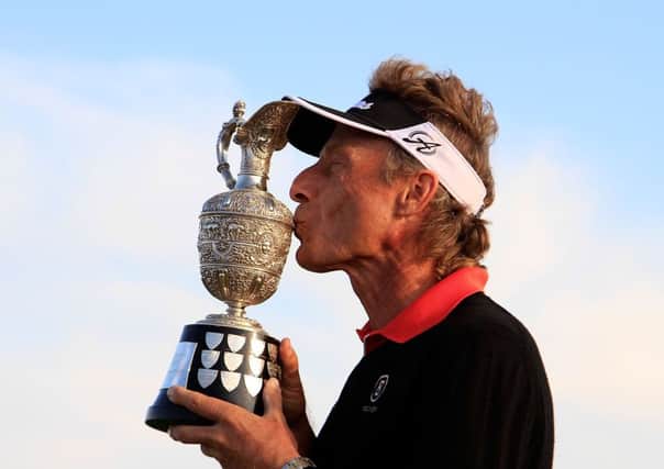 Bernhard Langer kisses the trophy after his victory by 13 strokes in the Senior Open at Royal Porthcawl yesterday. Picture: Getty