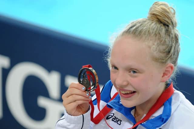 Shetland schoolgirl Erraid Davies shows off her medal. Picture: Lisa Ferguson