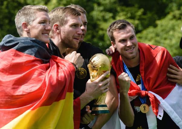 Bastian Schweinsteiger celebrates with his Germany team mates including  Kevin Grosskreutz, a Dortmund player. Picture: Getty