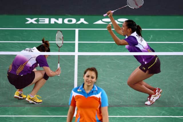 Singapore (top) celebrate victory in their women's doubles match over Ashwini Ponnappa and Jwala Gutta of India. Picture: Getty