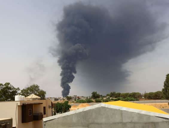 Smoke billows from the oil depot in southern Tripoli. Picture: Getty