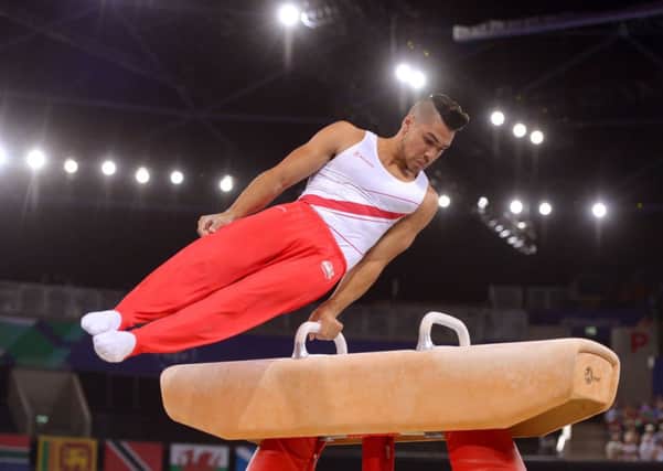 England's Louis Smith competes on the Pommel Horse during the Men's Team Final and Individual Qualification at the SEE Hydro. Picture: PA