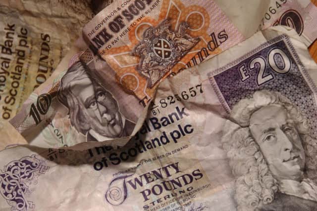 Fraudsters are attempting to pass off counterfeit banknotes in parts of Glasgow. Picture: Phil Wilkinson