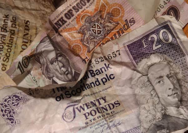 Fraudsters are attempting to pass off counterfeit banknotes in parts of Glasgow. Picture: Phil Wilkinson