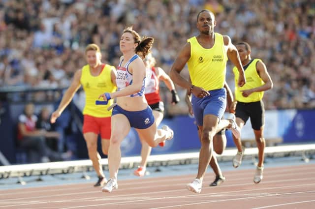 Libby Clegg of Scotland wins the gold medal in the womens para-sport 100m final T11/12. Picture: Greg Macvean