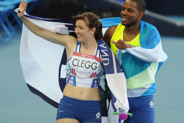 Scotland's Libby Clegg with guide runner Mikail Huggins after their win in the T11/12 100m. Picture: Neil Hanna
