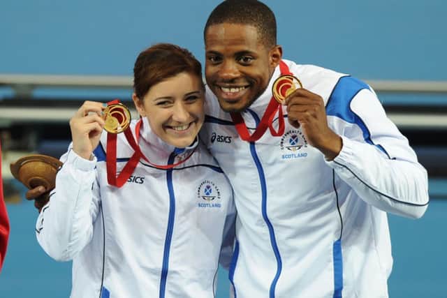 Libby Clegg and her guide Mikail Huggins celebrate their gold medals. Picture: Neil Hanna