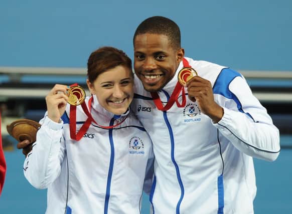 Libby Clegg and her guide Mikail Huggins celebrate their gold medals. Picture:


 Neil Hanna
