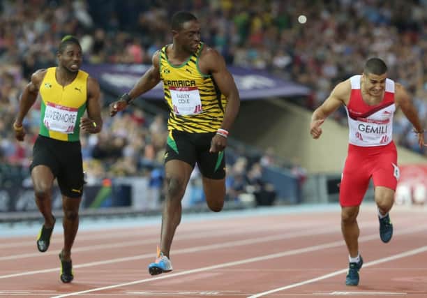 Kemar Bailey-Cole holds off Adam Gemili in the mens 100m. Picture: AP