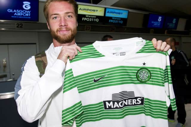 Jo Inge Berget just has time to pose with a Celtic shirt before jetting off to Warsaw. Picture: SNS