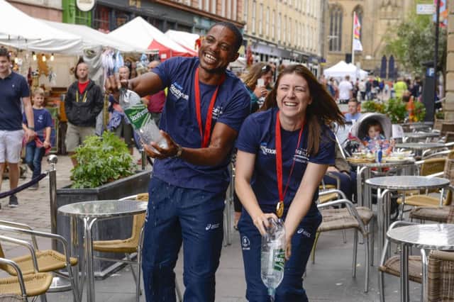 Libby Clegg and Mikail Huggins soak up the atmosphere in Glasgow