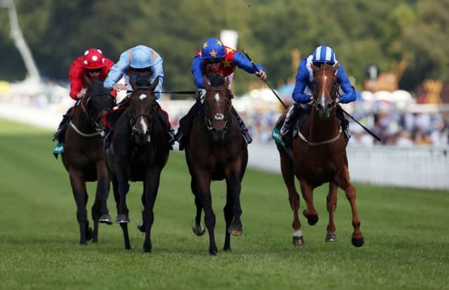 Es Que Love, ridden by Adam Kirby, wins the bet365 Lennox Stakes on the opening day of Goodwood. Picture: PA