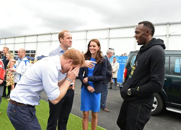 Prince Harry and the Duke and Duchess of Cambridge meet Usain Bolt. Picture: PA
