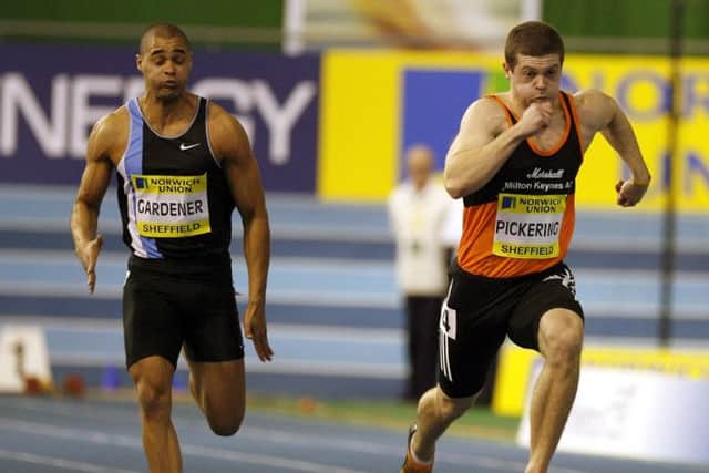 Craig Pickering (R) leads Jason Gardener in the mens 60m. Picture: Getty