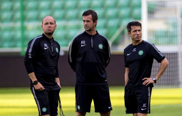 Ronny Deila, centre, is flanked by coaches Haakon Lunov and John Collins, right, as his players train in Warsaw. Picture: SNS