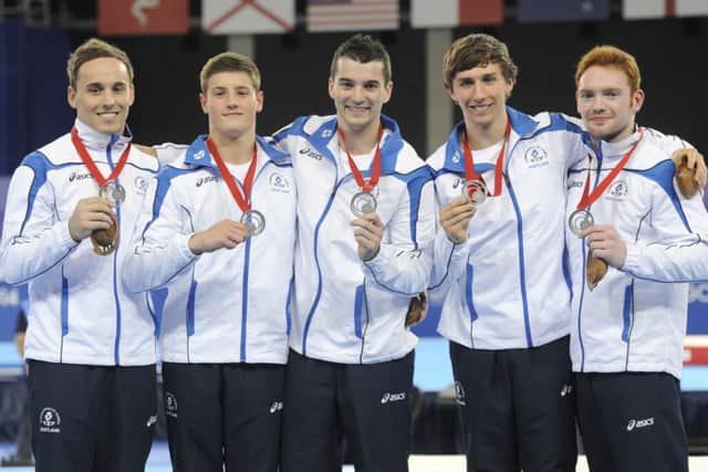 Scotland's men's artistic gymnastics team: Daniel Keatings, Frank Baines, Adam Cox, Liam Davie and Daniel Purvis with their silver medals. Picture: TSPL
