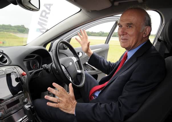 Look, no hands: Vince Cable in Miras driverless prototype. Picture: PA