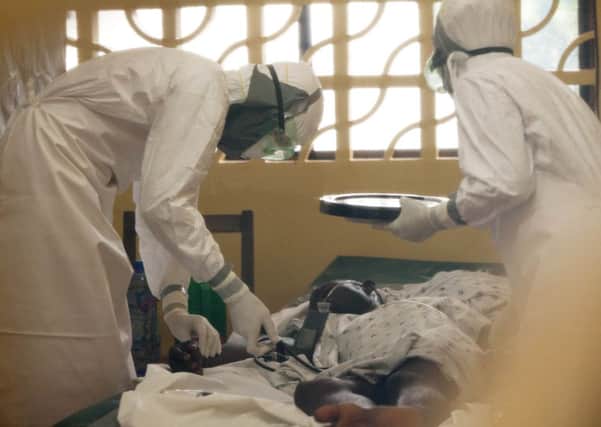 A doctor treats an Ebola patient at the Samaritan's Purse Ebola Case Management Center in Monrovia, Liberia. Picture: Samaritan's Purse