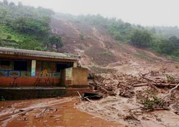 Mud and slush surround a building after a mudslide in Malin village, in the western Indian state of Maharashtra. Seventeen people have been killed by the landslip so far. Picture: AP