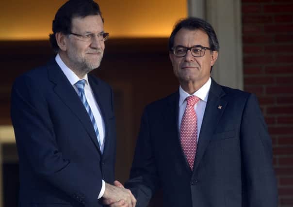 Spanish prime minister Mariano Rajoy, left, and Catalonia's president Artur Mas. Picture: Getty