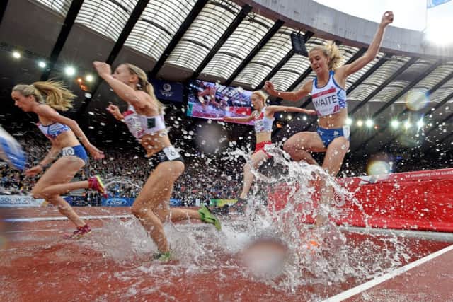 Scotlands steeplechasers Eilish McColgan, far left, and Lennie Waite, far right, tackle the water jump. Picture: Jane Barlow